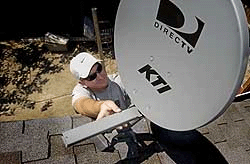 Peter installing a dish for Astra channels